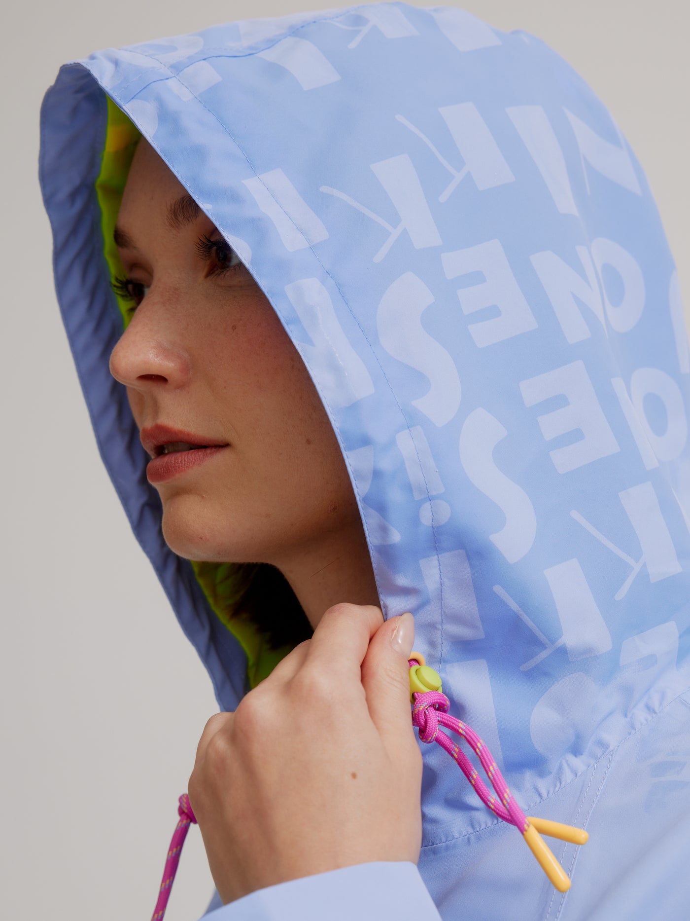 Nikki Jones Hooded Magic Print Raincoat W/ Adjustable Waist At Back & Zipper Pockets 